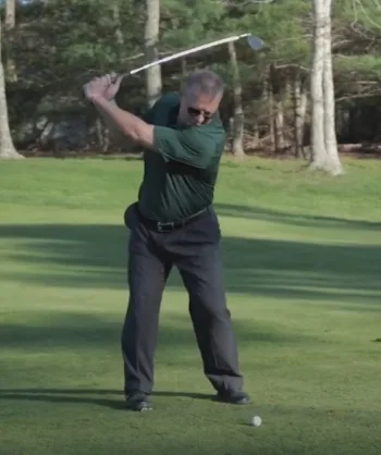 Steve Anzuoni at the top of a golf swing